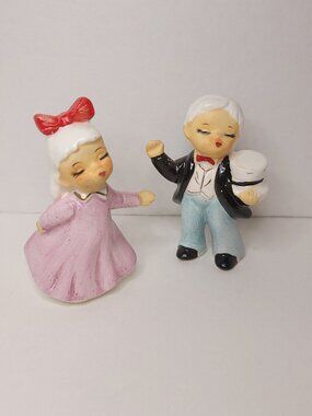 Antique Kissing Man and Woman Candle Holders